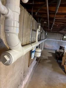 Residential drain and waste piping serviced by Empire State Plumbing in a Capital Region home
