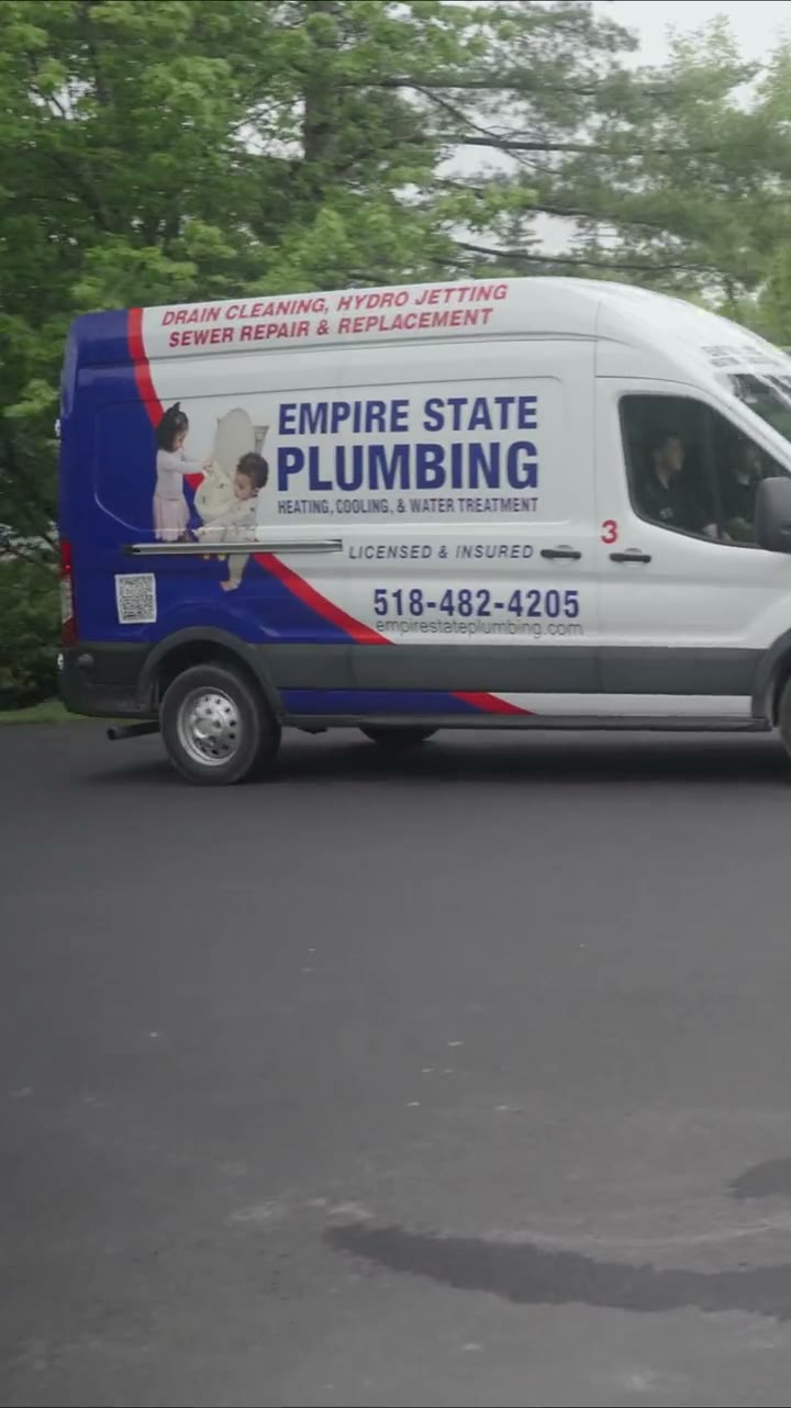 Empire State Plumbing branded service van arriving at a Capital Region home